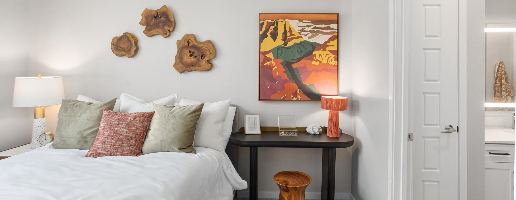 a bedroom with a bed and a table