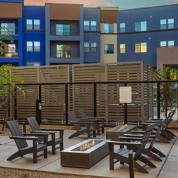 a fire pit near chairs