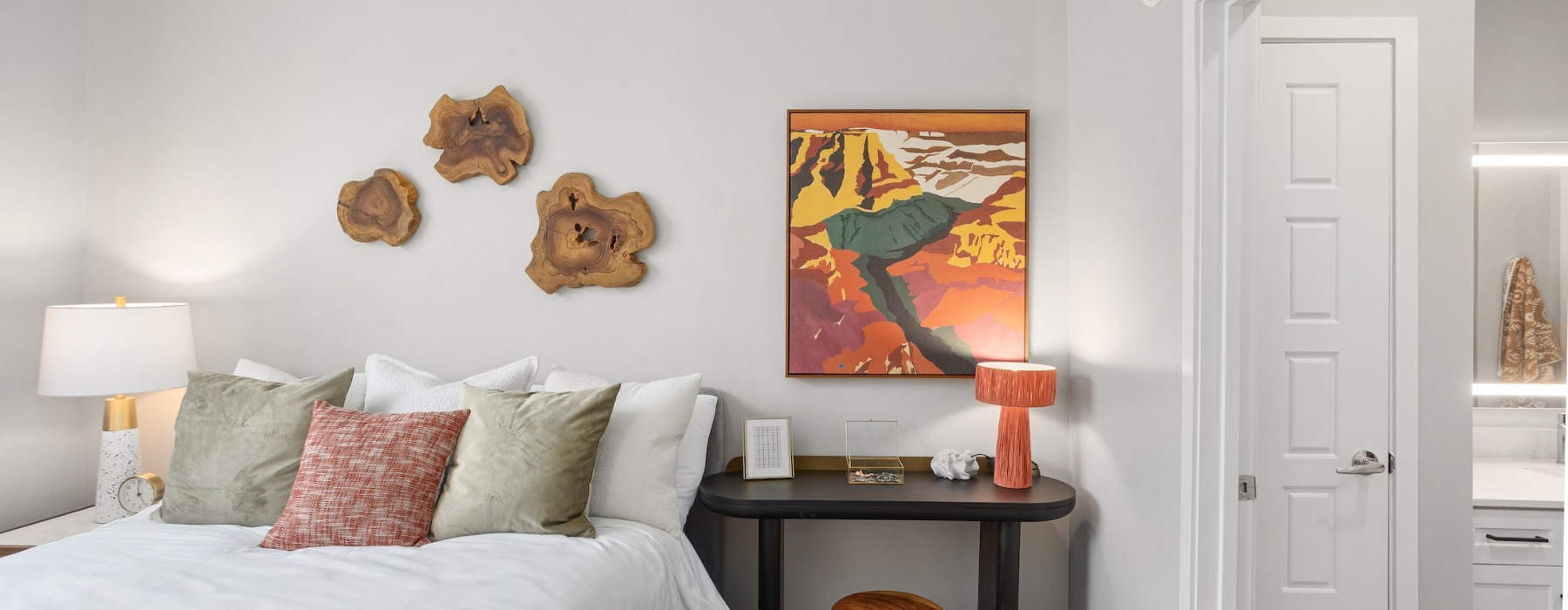 a bedroom with a bed and a table