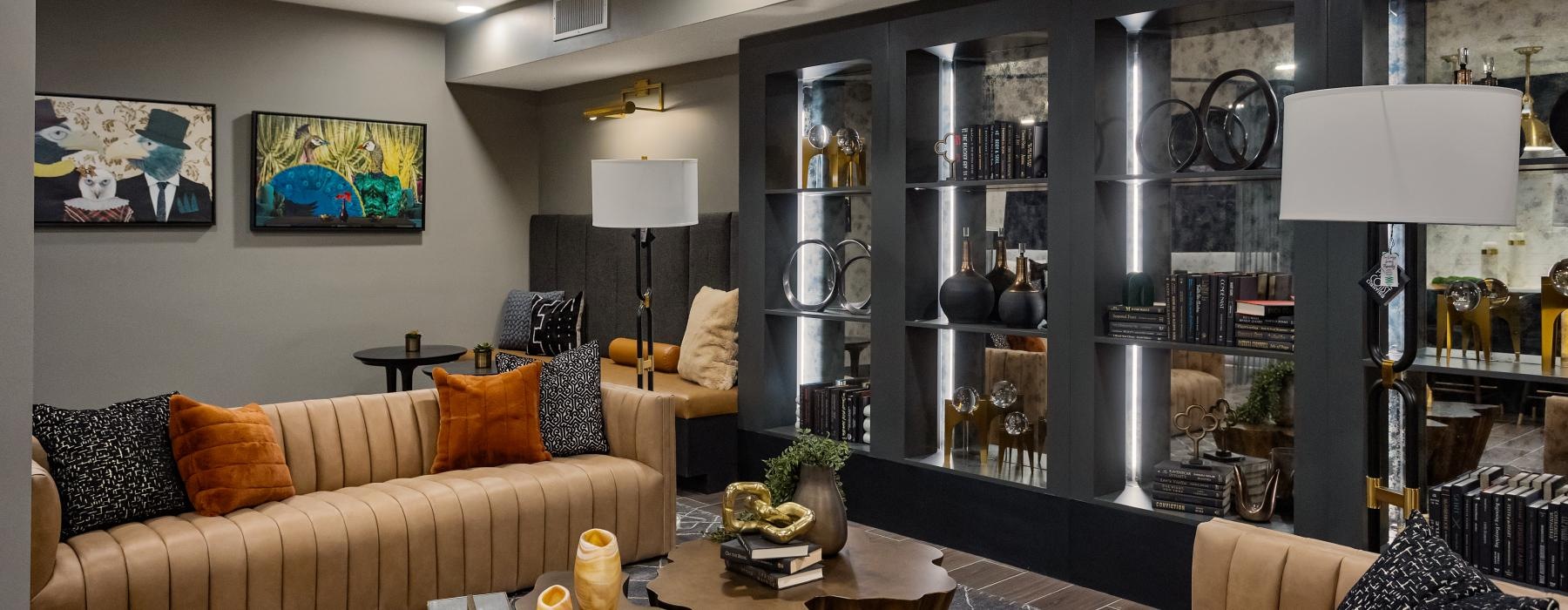 a sitting room with shelves and sofas