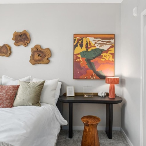 a bedroom with a bed and a table