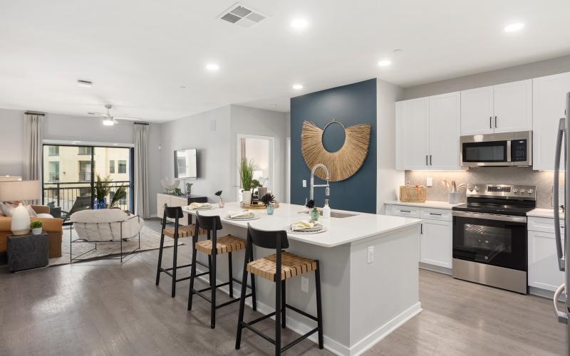 a kitchen with a dining table and chairs